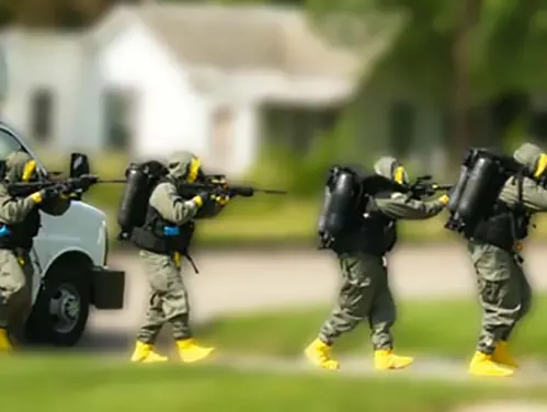 Polk County SWAT Team enters building with guns drawn during exercise.