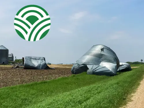 Grain bin damage in field due to severe storms. Iowa Dept. of Agriculture logo.