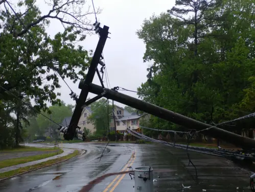Power lines down on road following storm.