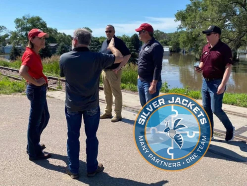 State agency directors and FEMA officials discuss Iowa flooding with Governor Reynolds in Hawarden, Iowa.