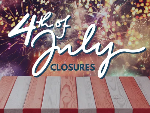 fireworks in sky behind a red and white table 