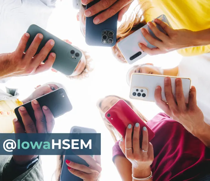 Circle of people on social media on cell phones with text: @IowaHSEM