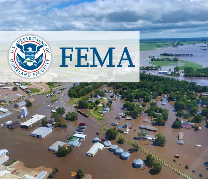 Aerial view of flooding in Iowa and FEMA logo.
