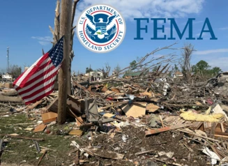 American flag hangs near widespread tornado damage in Greenfield, Iowa. Presidential Major Disaster Declaration for Iowa counties Adair, Polk, Story, and Montgomery.
