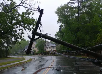 Power lines down on road following storm.