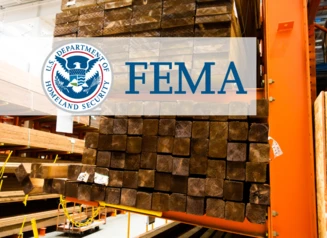Wood stacked in hardware store, FEMA logo.
