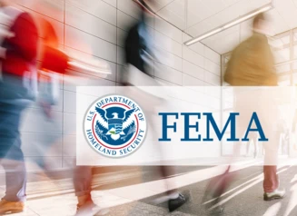 Students walking in hallway, FEMA logo