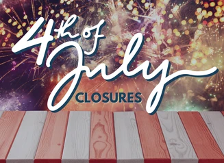 fireworks in sky behind a red and white table 