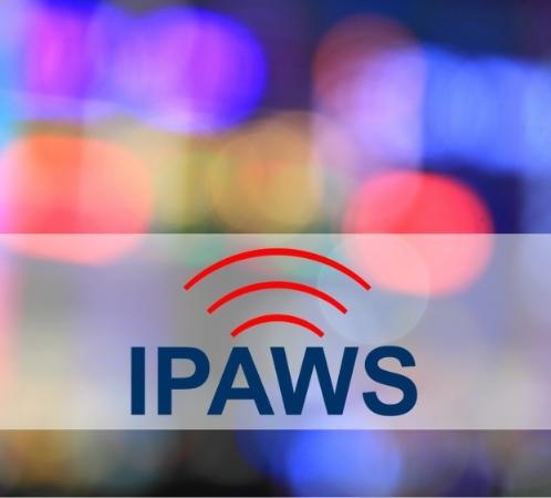 IPAWS logo with blurred emergency lights