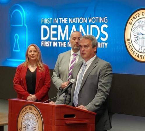 John Benson speaks at podium during election security press conference